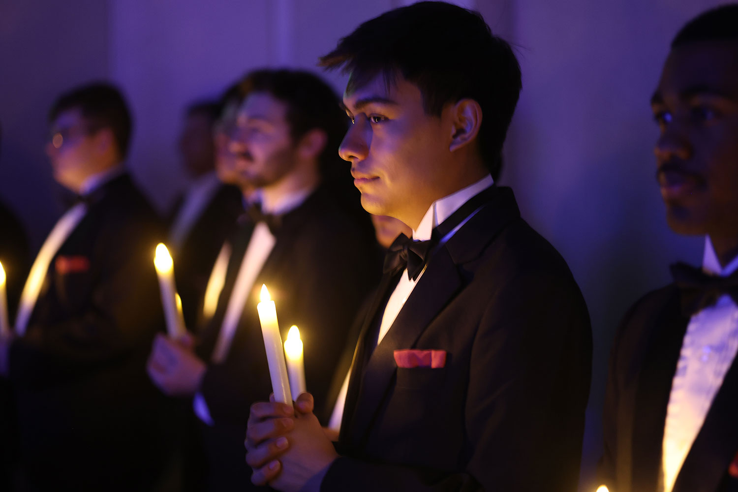 Baylor student holding a candle